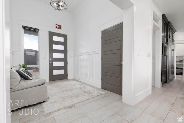 3658 W 2510 S, Hurricane, UT 84737 - foyer with wainscoting, a chandelier, and a decorative wall