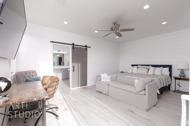 3658 W 2510 S, Hurricane, UT 84737 - bedroom featuring recessed lighting, a barn door, ensuite bath, ceiling fan, and light wood-style floors