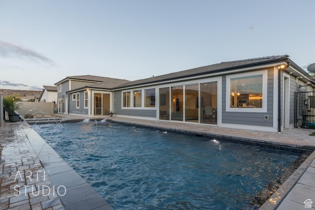3658 W 2510 S, Hurricane, UT 84737 - rear view of property featuring a patio, a fenced in pool, and fence