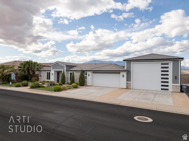 3658 W 2510 S, Hurricane, UT 84737 - view of front facade featuring concrete driveway, a garage, and stone siding