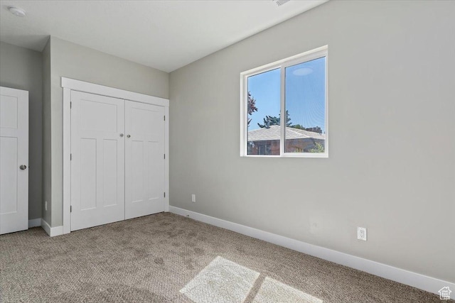 404 W 2700 S, Bountiful, UT 84010 - unfurnished bedroom featuring carpet flooring, a closet, and baseboards