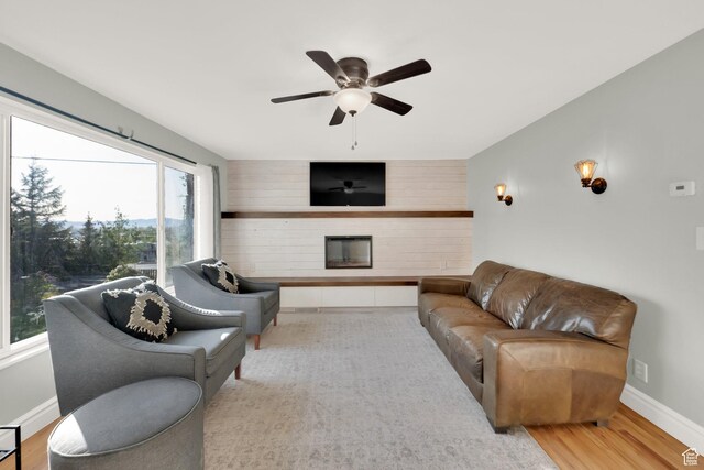 257 E Kingdon S, North Salt Lake, UT 84054 - living room with baseboards, ceiling fan, wood finished floors, and a fireplace
