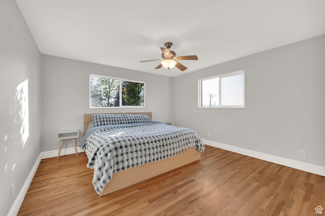 257 E Kingdon S, North Salt Lake, UT 84054 - bedroom featuring baseboards, wood finished floors, and multiple windows