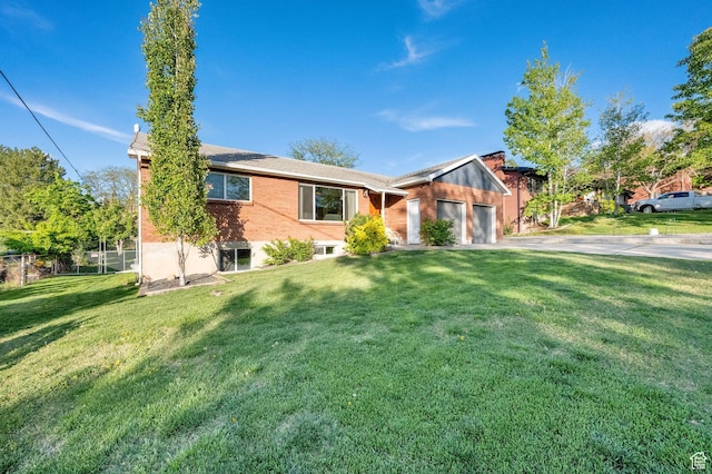 257 E Kingdon S, North Salt Lake, UT 84054 - ranch-style home with fence, an attached garage, brick siding, a front yard, and driveway