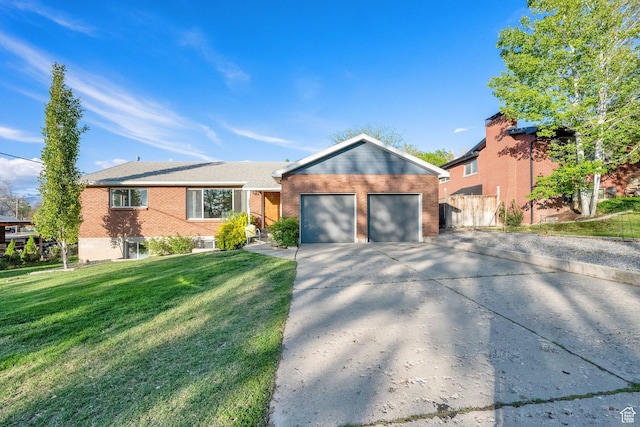 257 E Kingdon S, North Salt Lake, UT 84054 - single story home with a garage, brick siding, fence, a front lawn, and concrete driveway