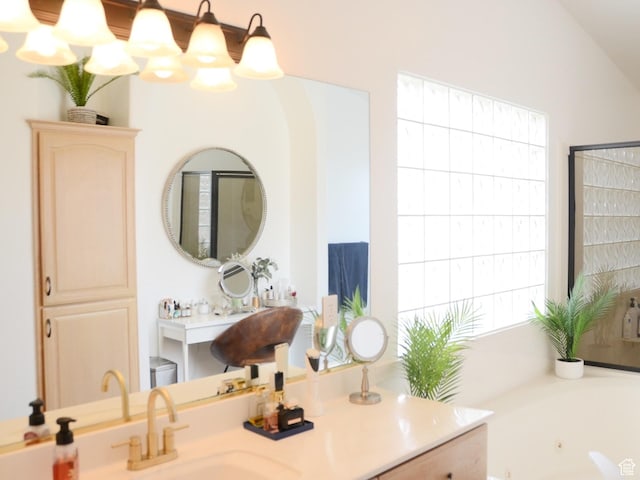 1087 E Fort Pierce Dr, St George, UT 84790 - bathroom with a tub with jets, a sink, and a wealth of natural light