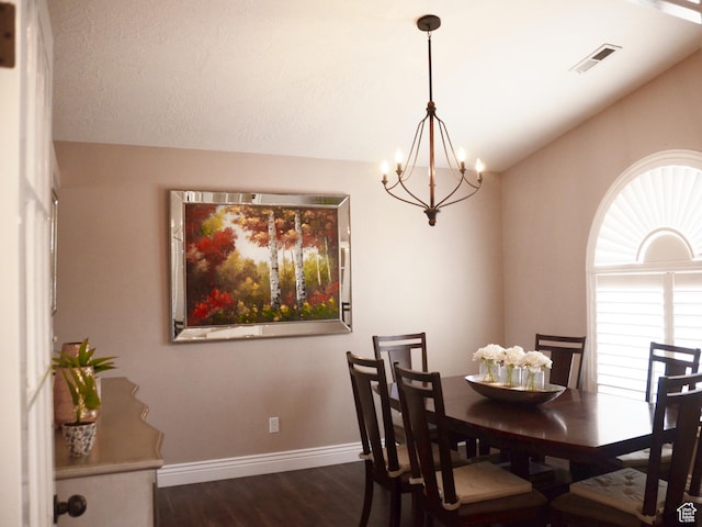 1087 E Fort Pierce Dr, St George, UT 84790 - dining room with visible vents, dark wood-style flooring, baseboards, a chandelier, and vaulted ceiling