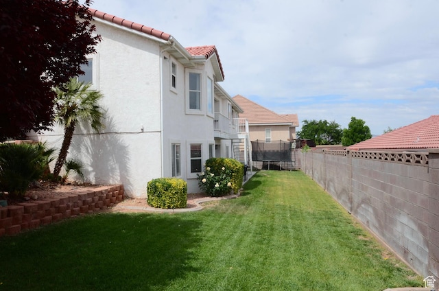 1087 E Fort Pierce Dr, St George, UT 84790 - view of yard with a fenced backyard and a trampoline