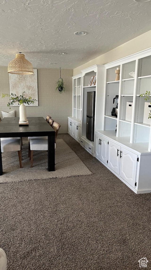 1087 E Fort Pierce Dr, St George, UT 84790 - interior space with a textured ceiling and dark carpet