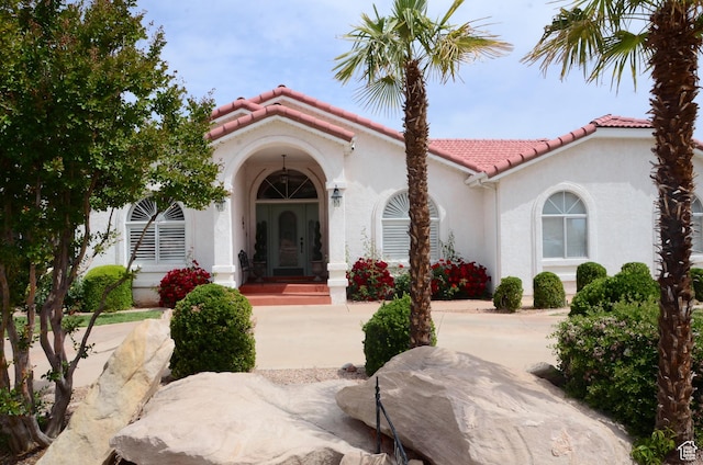 1087 E Fort Pierce Dr, St George, UT 84790 - view of front facade featuring stucco siding and a tiled roof