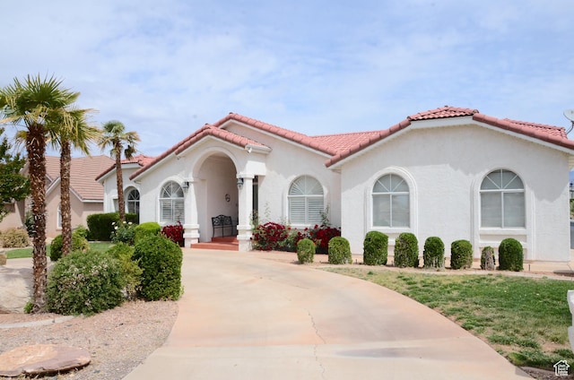 1087 E Fort Pierce Dr, St George, UT 84790 - view of front of house featuring stucco siding and a tile roof