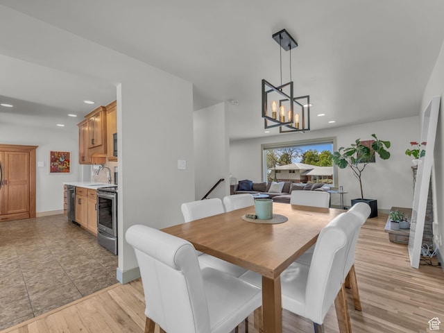 4363 S Butternut Rd E, Holladay, UT 84124 - dining room featuring light wood-style floors, baseboards, an inviting chandelier, and recessed lighting