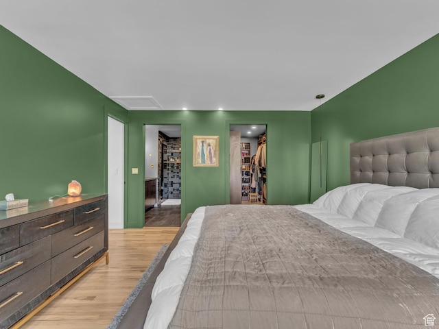 4363 S Butternut Rd E, Holladay, UT 84124 - bedroom featuring a closet, attic access, light wood finished floors, and a spacious closet