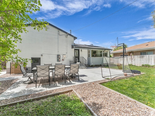 4363 S Butternut Rd E, Holladay, UT 84124 - rear view of property with brick siding, a patio, a yard, and fence