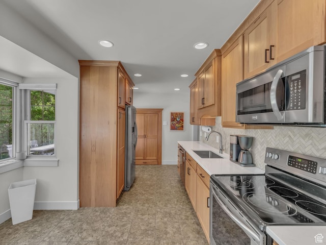4363 S Butternut Rd E, Holladay, UT 84124 - kitchen featuring baseboards, a sink, appliances with stainless steel finishes, and light countertops