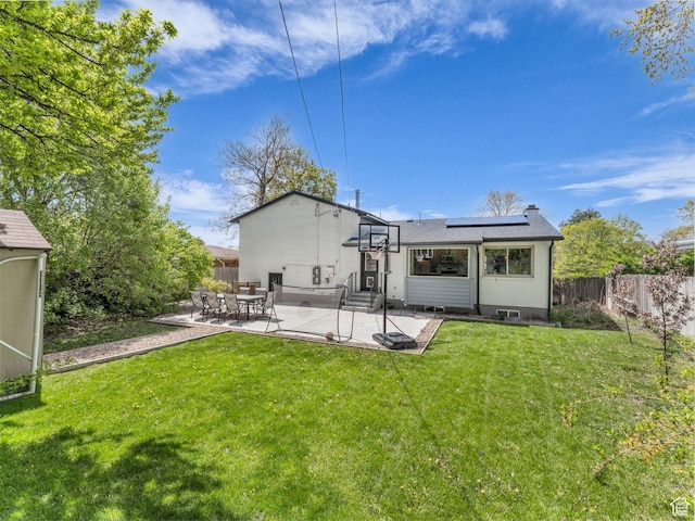 4363 S Butternut Rd E, Holladay, UT 84124 - rear view of house featuring solar panels, a lawn, a patio area, a fenced backyard, and entry steps