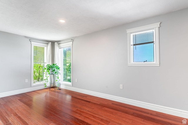 1340 E Oakmont Ln, Fruit Heights, UT 84037 - spare room with baseboards, a wealth of natural light, recessed lighting, and wood finished floors