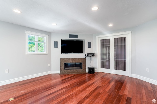 1340 E Oakmont Ln, Fruit Heights, UT 84037 - unfurnished living room with french doors, wood finished floors, recessed lighting, baseboards, and a glass covered fireplace