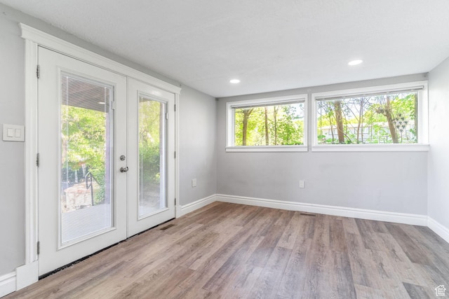1340 E Oakmont Ln, Fruit Heights, UT 84037 - interior space featuring french doors, recessed lighting, baseboards, visible vents, and wood finished floors