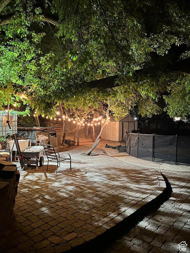 1340 E Oakmont Ln, Fruit Heights, UT 84037 - view of patio / terrace with a trampoline and fence