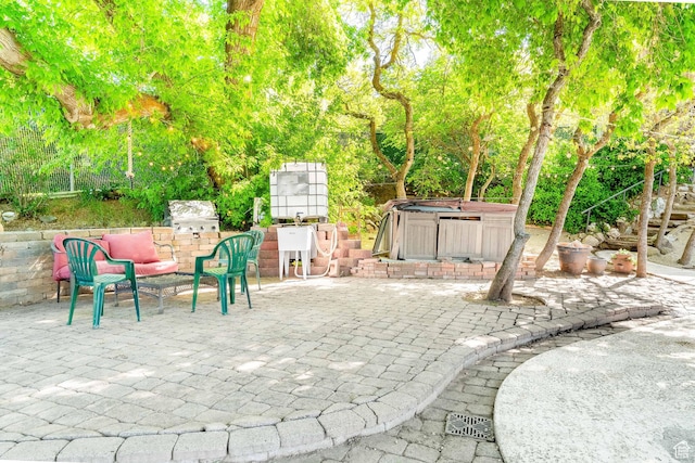 1340 E Oakmont Ln, Fruit Heights, UT 84037 - view of patio / terrace with a jacuzzi and a grill
