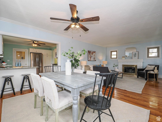 1453 E Vine St S, Murray, UT 84121 - dining room featuring crown molding, a ceiling fan, and light wood finished floors