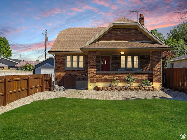1453 E Vine St S, Murray, UT 84121 - view of front of home with a chimney, brick siding, a porch, and roof with shingles