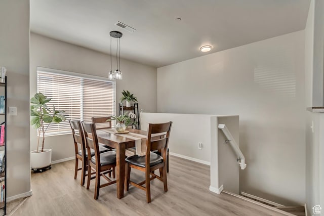 6626 W Ivy Gable Dr S, West Jordan, UT 84081 - dining space featuring baseboards, visible vents, and light wood-style flooring