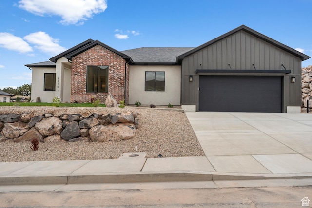 2316 S 2925 W, Cedar City, UT 84720 - view of front of home featuring brick siding, driveway, roof with shingles, and a garage