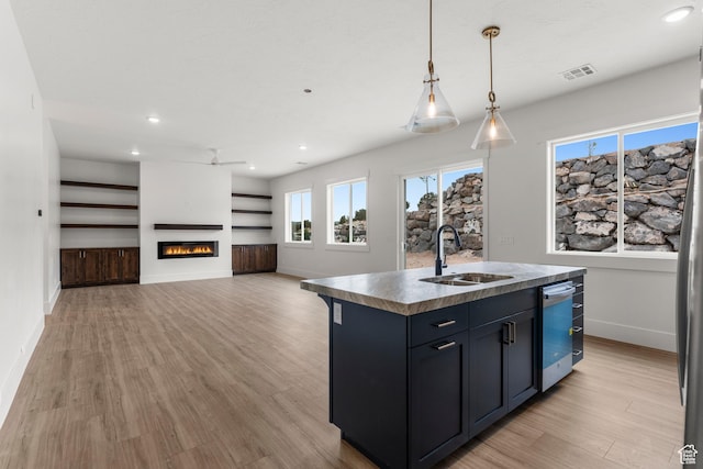 2316 S 2925 W, Cedar City, UT 84720 - kitchen featuring a sink, light wood-style flooring, baseboards, stainless steel dishwasher, and visible vents
