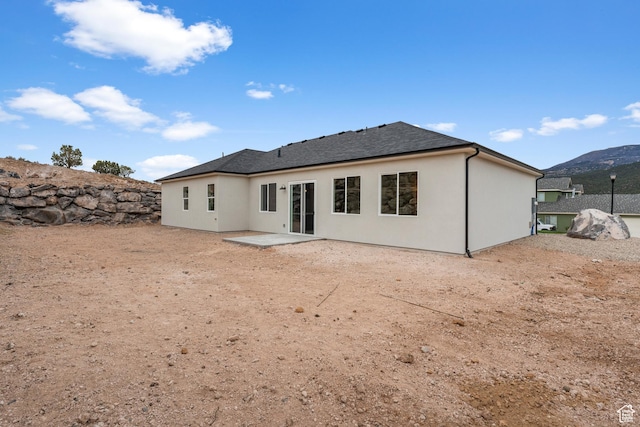 2316 S 2925 W, Cedar City, UT 84720 - rear view of property with a patio, a shingled roof, a mountain view, and stucco siding