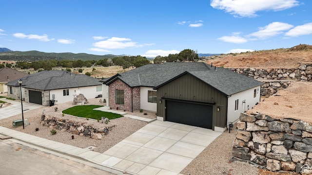 2316 S 2925 W, Cedar City, UT 84720 - single story home with a garage, a shingled roof, board and batten siding, concrete driveway, and a mountain view
