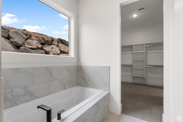 2316 S 2925 W, Cedar City, UT 84720 - bathroom with marble finish floor, visible vents, a spacious closet, and a garden tub