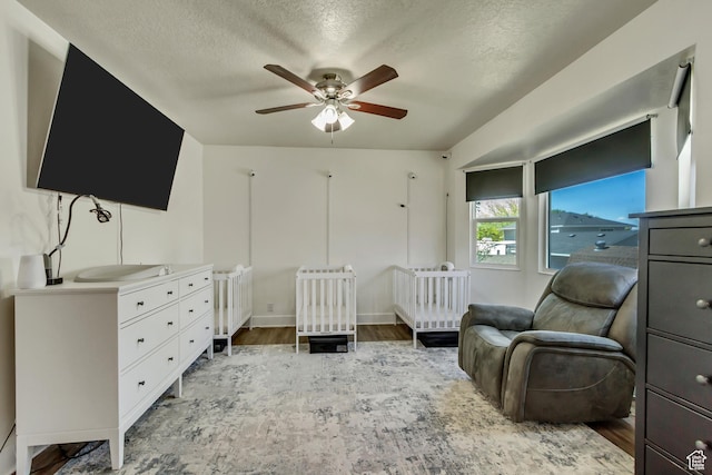 1235 W 1870 N, Lehi, UT 84043 - bedroom with baseboards, ceiling fan, a textured ceiling, and wood finished floors