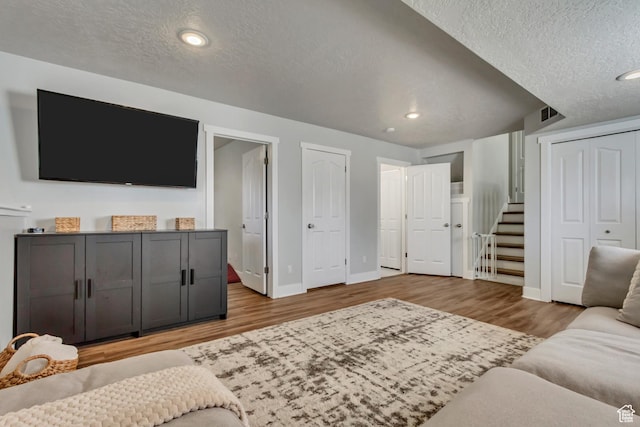 1235 W 1870 N, Lehi, UT 84043 - living area with a textured ceiling, recessed lighting, baseboards, wood finished floors, and visible vents