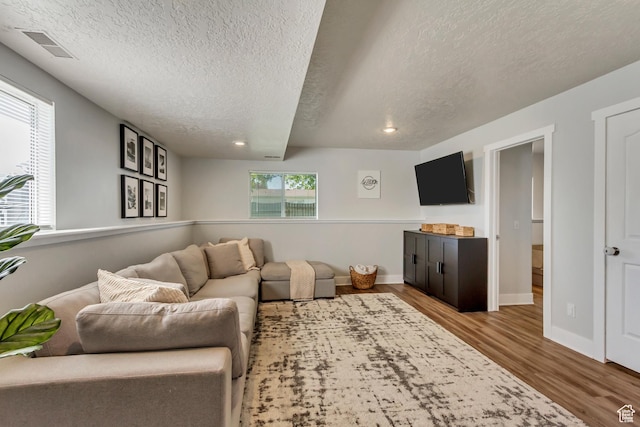 1235 W 1870 N, Lehi, UT 84043 - living room featuring a textured ceiling, recessed lighting, baseboards, wood finished floors, and visible vents