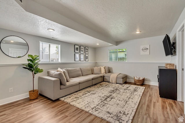 1235 W 1870 N, Lehi, UT 84043 - living room with recessed lighting, a textured ceiling, baseboards, and light wood-type flooring