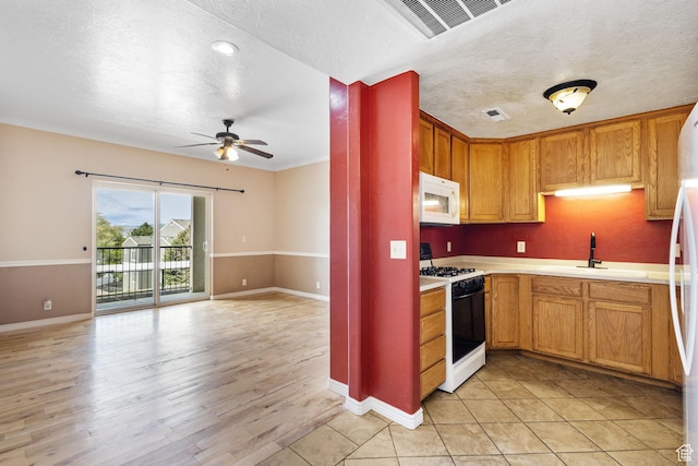1474 S 430 W Unit 23, Orem, UT 84058 - kitchen featuring visible vents, white appliances, ceiling fan, light countertops, and a sink