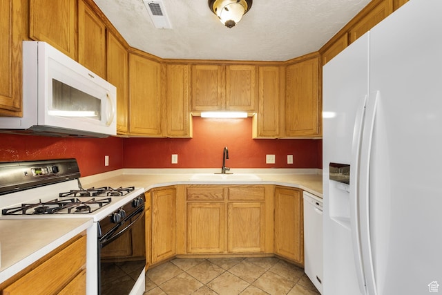 1474 S 430 W Unit 23, Orem, UT 84058 - kitchen featuring light tile patterned flooring, a sink, white appliances, light countertops, and visible vents