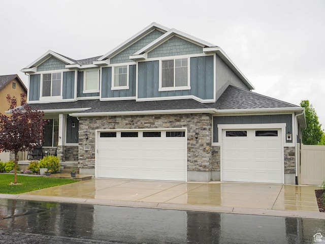 10953 S Kelso Dune Dr, South Jordan, UT 84009 - craftsman-style home with a garage, stone siding, roof with shingles, board and batten siding, and driveway