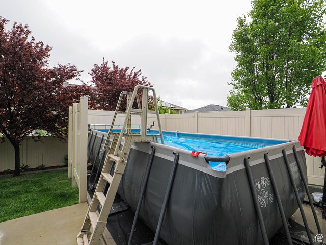 10953 S Kelso Dune Dr, South Jordan, UT 84009 - view of swimming pool featuring a fenced in pool and a fenced backyard
