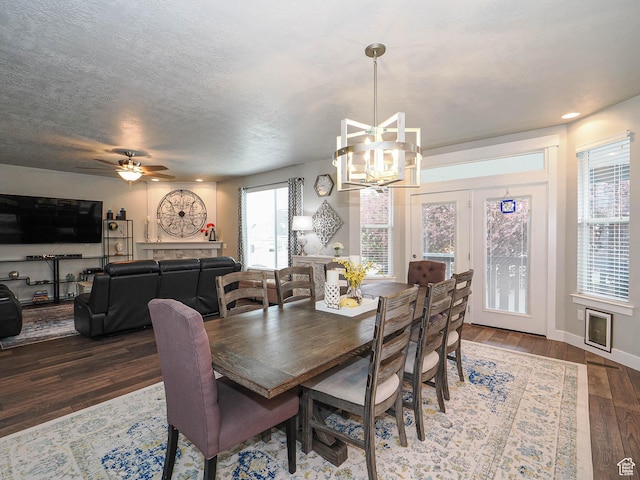 10953 S Kelso Dune Dr, South Jordan, UT 84009 - dining space featuring a textured ceiling, baseboards, hardwood / wood-style flooring, and ceiling fan with notable chandelier