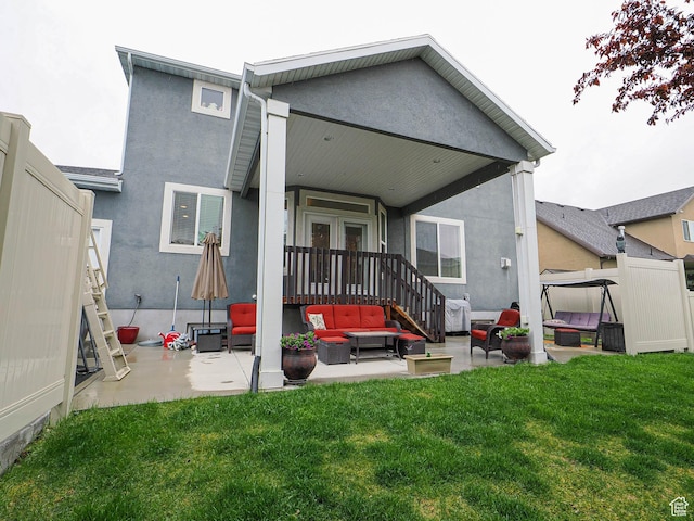 10953 S Kelso Dune Dr, South Jordan, UT 84009 - rear view of house with a lawn, outdoor lounge area, a patio area, and stucco siding