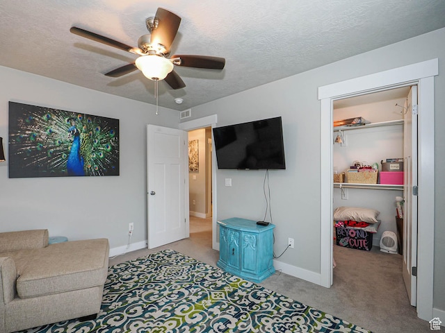 10953 S Kelso Dune Dr, South Jordan, UT 84009 - living room featuring baseboards, ceiling fan, a textured ceiling, and light colored carpet