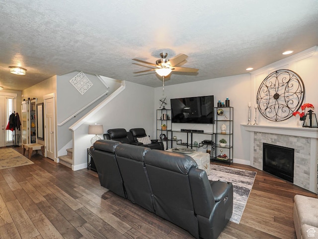 10953 S Kelso Dune Dr, South Jordan, UT 84009 - living area featuring a textured ceiling, stairs, a ceiling fan, baseboards, and dark wood-type flooring