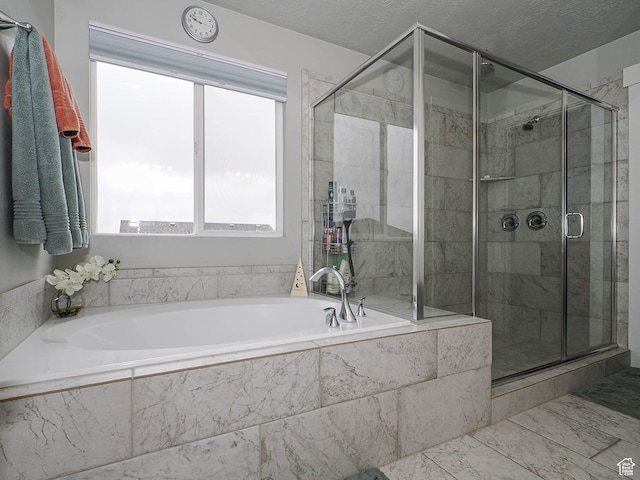 10953 S Kelso Dune Dr, South Jordan, UT 84009 - full bath with marble finish floor, a bath, and a shower stall