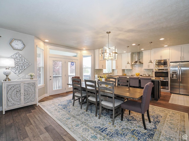 10953 S Kelso Dune Dr, South Jordan, UT 84009 - dining area featuring dark wood-style flooring, baseboards, an inviting chandelier, and recessed lighting