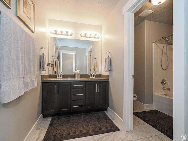 10953 S Kelso Dune Dr, South Jordan, UT 84009 - bathroom with double vanity, a sink, baseboards, and toilet