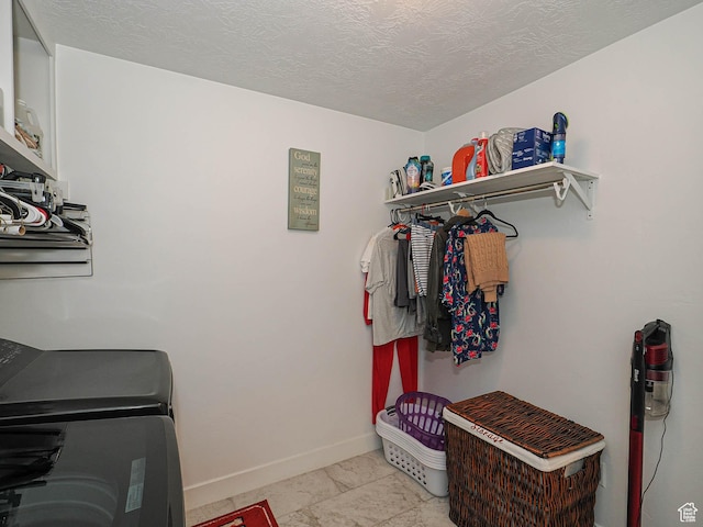 10953 S Kelso Dune Dr, South Jordan, UT 84009 - laundry room featuring baseboards, laundry area, independent washer and dryer, and a textured ceiling