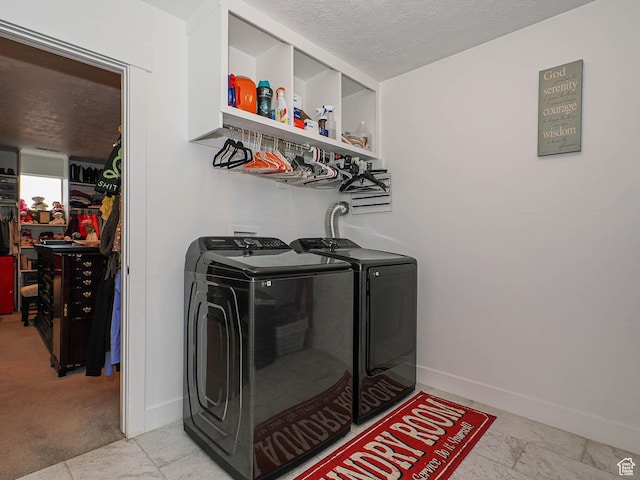 10953 S Kelso Dune Dr, South Jordan, UT 84009 - laundry area with laundry area, washing machine and dryer, baseboards, a textured ceiling, and bar